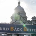 With the U.S. Capitol dome in the background, a sign that reads "Build Bake Better" is displayed before a news conference, Wednesday, Dec. 15, 2021, on Capitol Hill in Washington. (AP Photo/Jacquelyn Martin) [ JACQUELYN MARTIN | AP ]