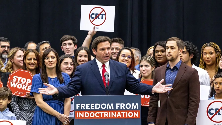 Gov. Ron DeSantis addresses the crowd before publicly signing HB 7, the "Individual Freedom Act," also dubbed the "Stop WOKE" bill during a news conference at Mater Academy Charter Middle/High School in Hialeah Gardens in April 2022. [ DANIEL A. VARELA | AP ]