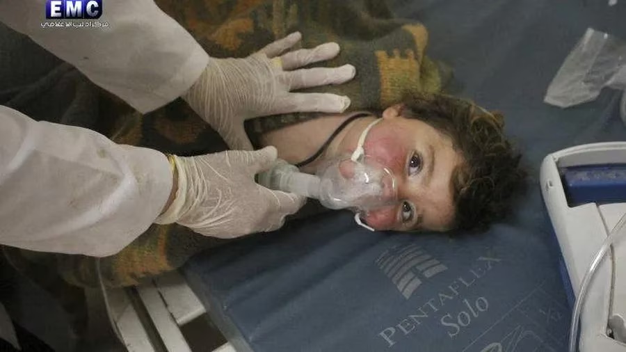 A Syrian doctor in the town of Khan Sheikhoun treats a child after a chemical weapons attack in 2017. Then-president Donald Trump ordered a missile strike against a Syrian airbase in retaliation.